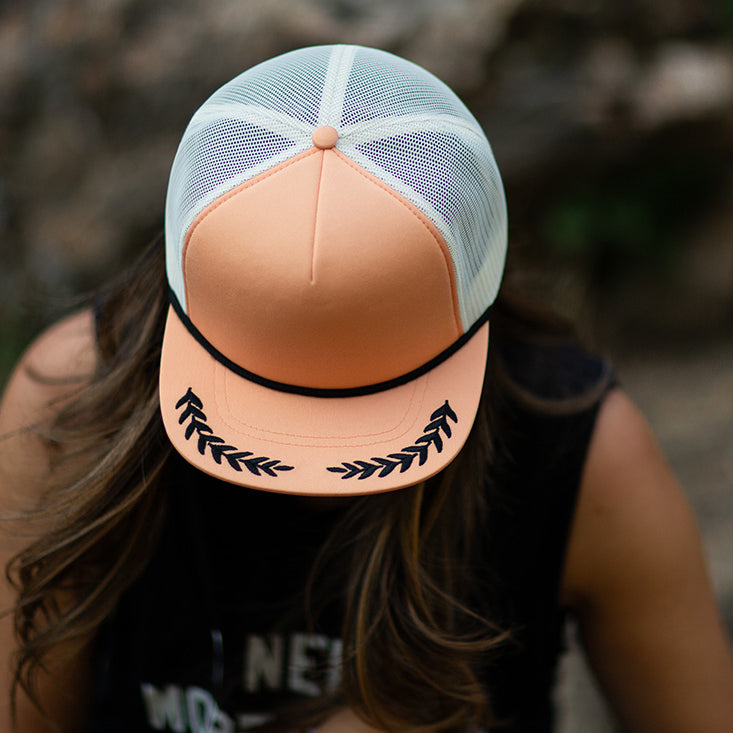Woman wearing the Blvnk Headwear El Capitan Trucker Hat
