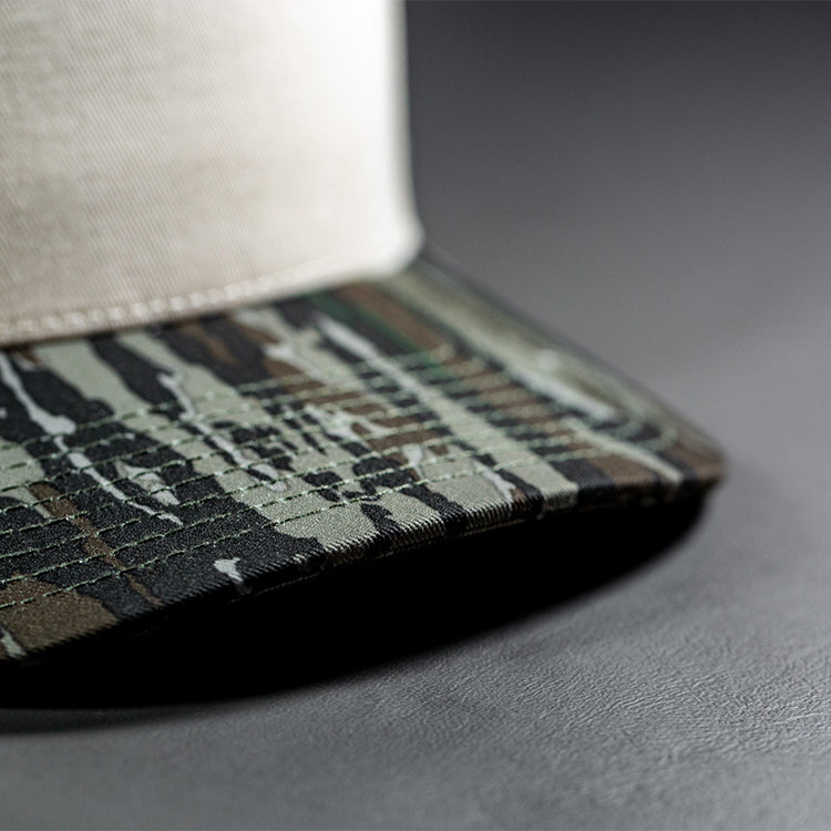 all-groups Blvnk Headwear Origin Vintage Shape blank Snapback in Natural and Realtree Original Camo bill close up detail.