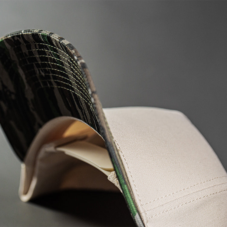 all-groups Blvnk Headwear Origin Vintage Shape blank Snapback in Natural and Realtree Original Camo under bill close up.