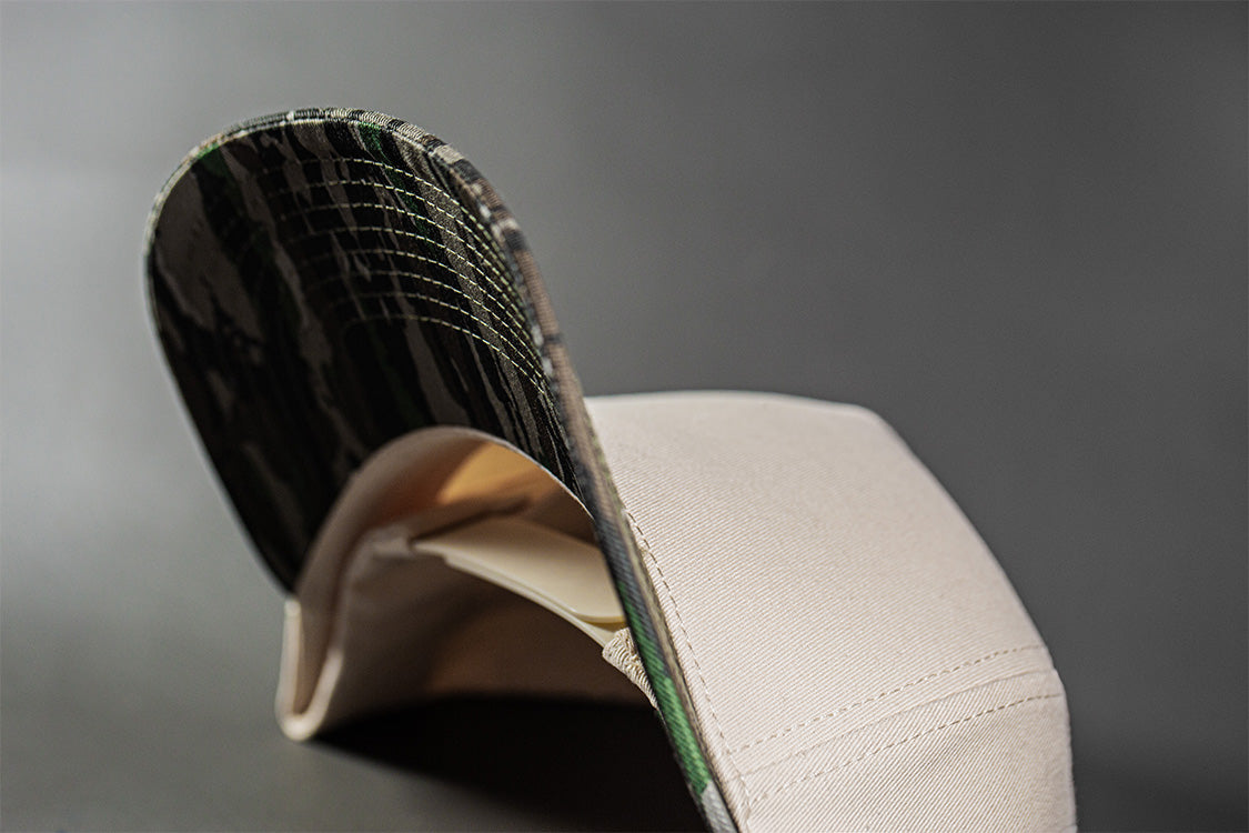 all-groups Blvnk Headwear Origin Vintage Shape blank Snapback in Natural and Realtree Original Camo under bill close up.