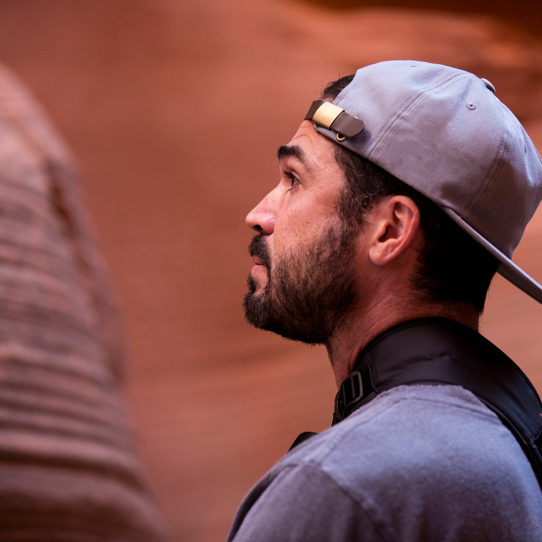 all-groups - A man wearing Blvnk Headwear's Roam Strapback hat in Steel Grey in Secret Canyon, Utah.