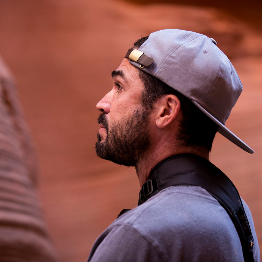 all-groups - A man wearing Blvnk Headwear's Roam Strapback hat in Steel Grey in Secret Canyon, Utah.