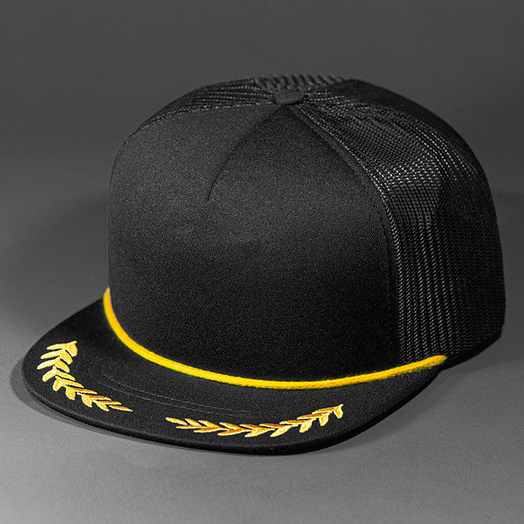 The El Capitan blank trucker hat from BLVNK HEADWEAR in Black and Gold.