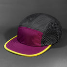 The Ultra Tech blank performance 5 Panel Runners Cap in Berry Black and Lion Yellow by Blvnk Headwear.