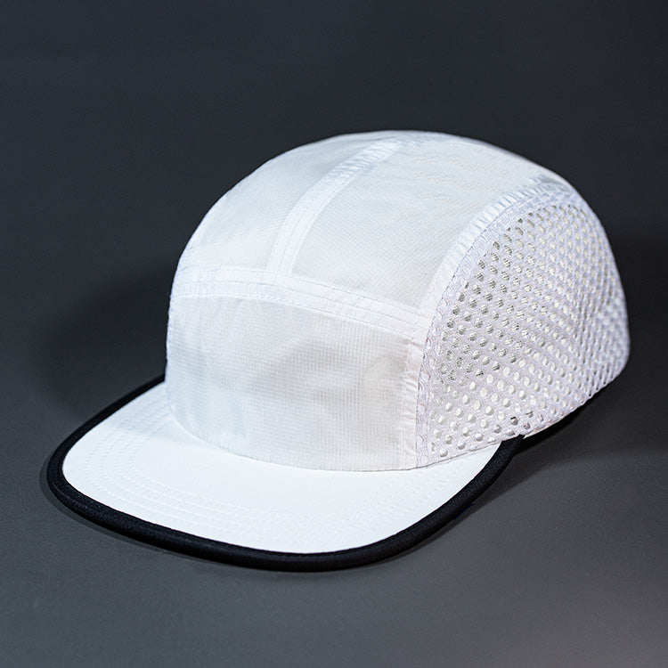 The Ultra Tech blank performance 5 Panel Runners Cap in White and Black by Blvnk Headwear.