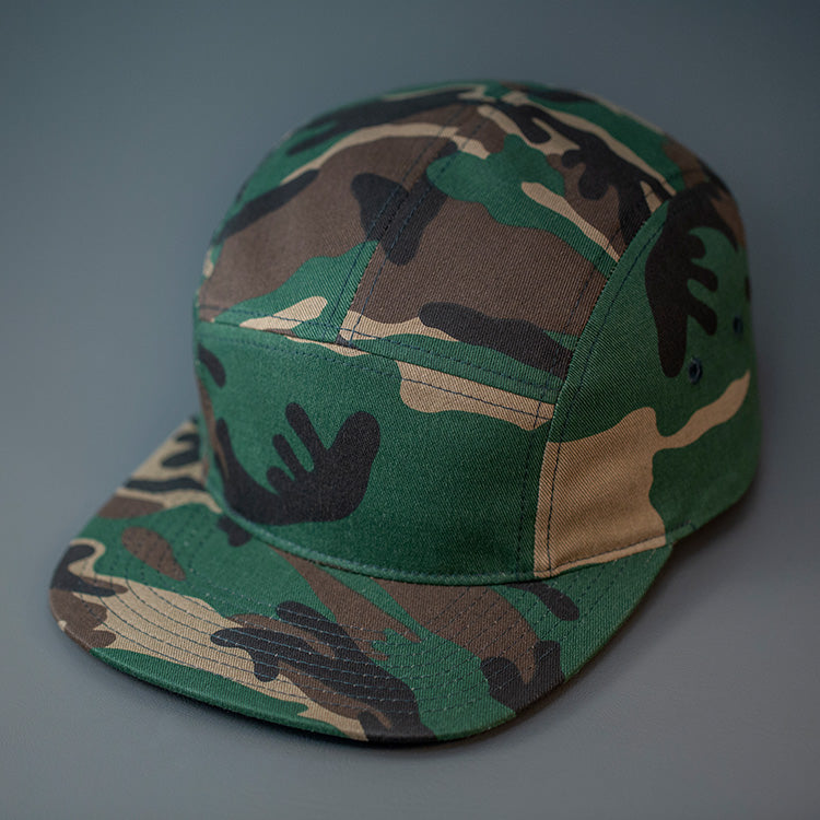 A Camo, Cotton Twill, Blank 5 Panel Camp Hat With a Flat Bill, & Woven Nylon Strapback. Designed by Blvnk Headwear