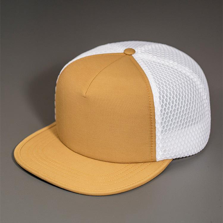 A Water Resistant Nylon, Blank Trucker Hat with a Packable Flotation Bill with a Hydro Mesh back & Woven Nylon Strapback. | Camel & White Colorway by BLVNK Headwear.