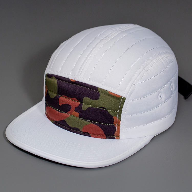 A Camo & White Quilted Nylon, Blank 5 Panel Camp Hat featuring a Packable Visor, Satin Lining & a Woven Nylon Backstrap. | Designed by Blvnk Headwear