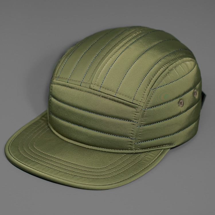 A Loden Quilted Nylon, Blank 5 Panel Camp Hat featuring a Packable Visor, Satin Lining & a Woven Nylon Backstrap. | Designed by Blvnk Headwear