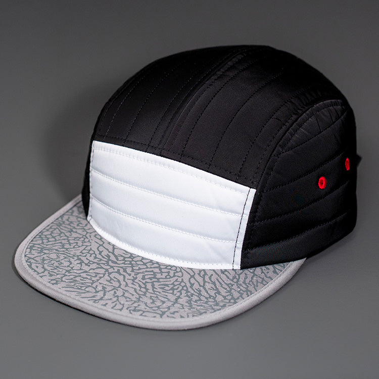 A White & Black Quilted Nylon, Blank 5 Panel Camp Hat featuring an Rihno Printed Packable Flat Bill, Satin Lining & a Woven Nylon Backstrap. | Designed by Blvnk Headwear