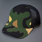 A Camo & Black, Cotton Twill, Mesh Backed, Blank Trucker Hat with a Pre Curved Bill, & Classic Snapback.  |  Designed by Blvnk Headwear