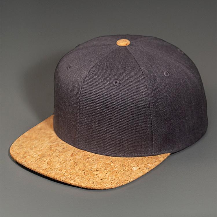 A Heather Charcoal Wool Crown, Blank 6 Panel Hat with a Cork Flat Bill & Classic Snapback.  Designed by Blvnk Headwear.