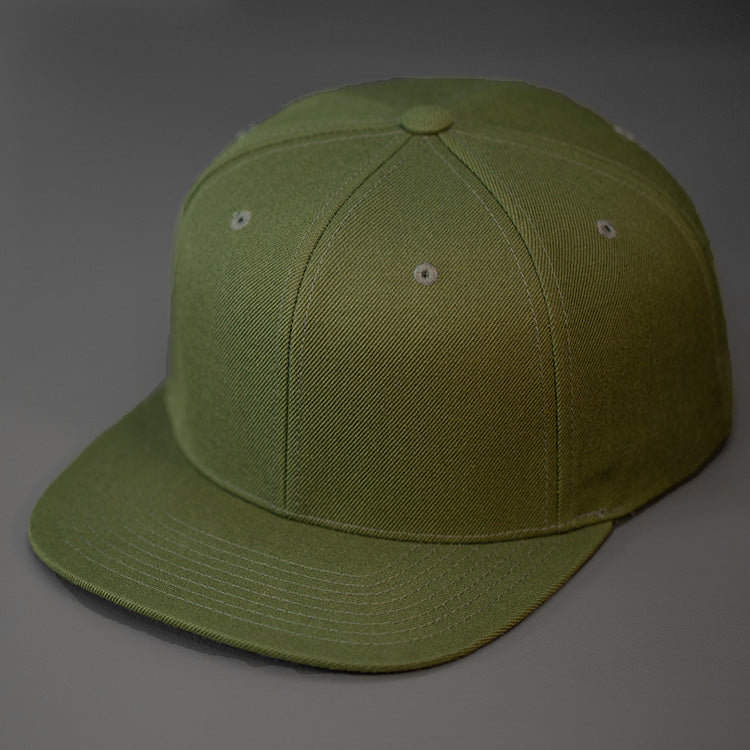 An Army Olive Green, Wool, 6 Panel, Flat Bill, Blank Snapback. Designed by Blvnk Headwear.
