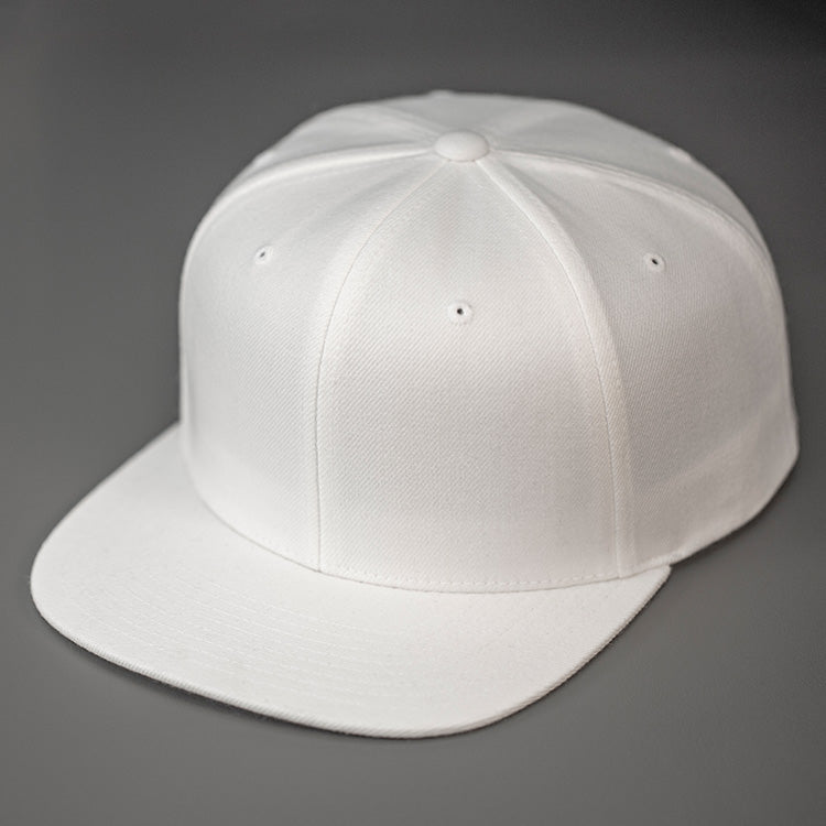 A White, Wool, 6 Panel, Flat Bill, Blank Snapback. Designed by Blvnk Headwear.