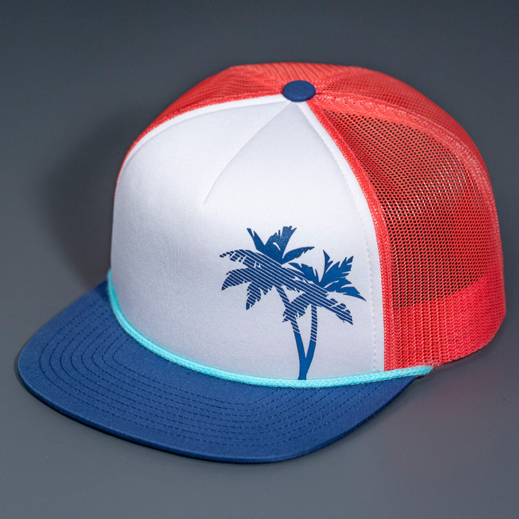 A White and Navy Palm Tree Printed Foam Front, Coral Mesh Backed, Blank Trucker Hats with a Flat Bill, & Classic Snapback. Designed By Blvnk Headwear.