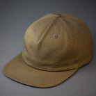 A Buck Green, Unstructured, Premium Cotton, Blank Pinch Front Hat With a Vegan Leather Back Strap & Brass Clasp.  Designed By Blvnk Headwear.