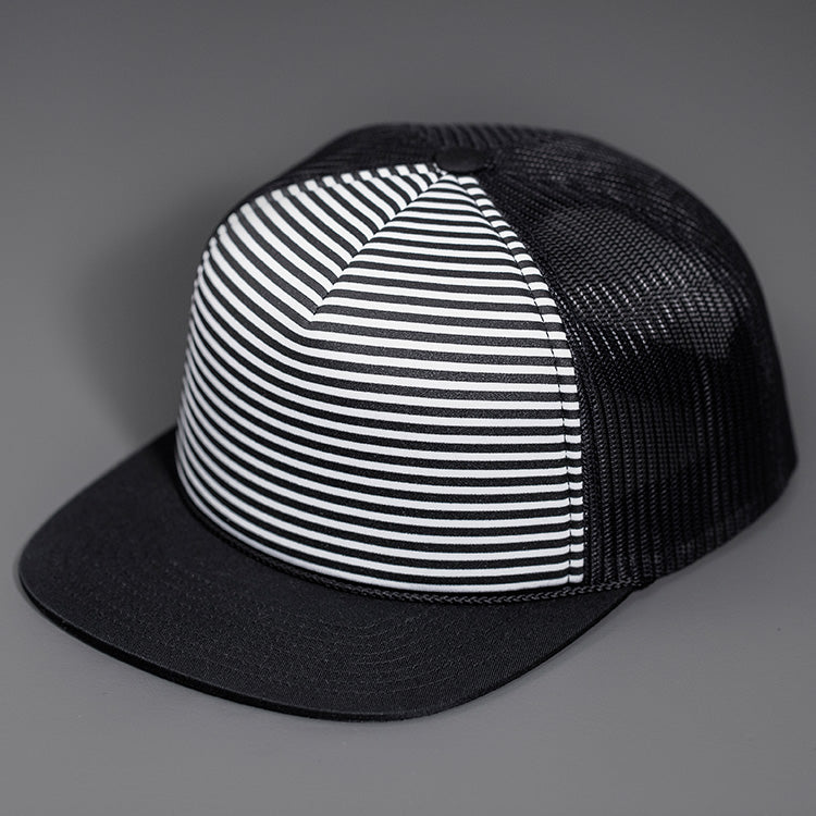 A Black & White Striper Printed Foam Front, Black Mesh Backed, Blank Trucker Hats with a Black Flat Bill, & Classic Snapback. Designed By Blvnk Headwear.