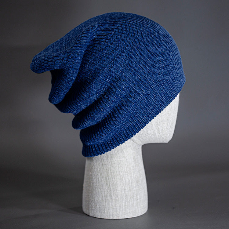 A navy colored, super slouch knit blank beanie.  Designed by Blvnk Headwear.