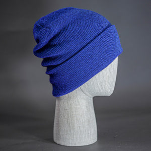 The Hood Heathered Beanie, a heather royal colored, tight knit, mid length blank beanie. Designed by Blvnk Headwear.