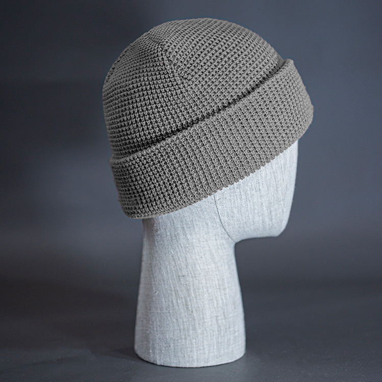 The Waffle Beanie, a heather grey colored, waffle knit blank beanie. Designed by Blvnk Headwear.