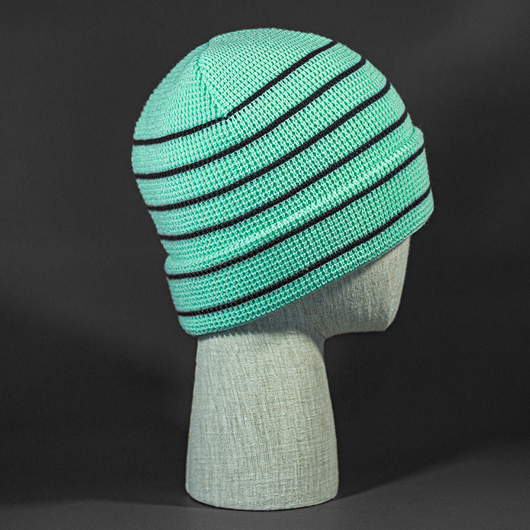 The Brussels Blank Waffle Beanie in Seafoam and Black by Blvnk Headwear.