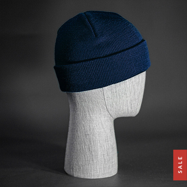 The Longshore Beanie, a navy colored, tight knit, short length blank beanie. Designed by Blvnk Headwear.