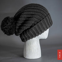 Blvnk Sundance Beanie in Heather Charcoal s an extra long super slouchy cuffed blank beanie with a chunky knit and oversized pom pom. Now on Sale at blvnkheadwear.com