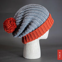 Blvnk Sundance Beanie in Heather Grey and Rust is an extra long super slouchy cuffed blank beanie with a chunky knit and oversized pom pom. Now on Sale at blvnkheadwear.com