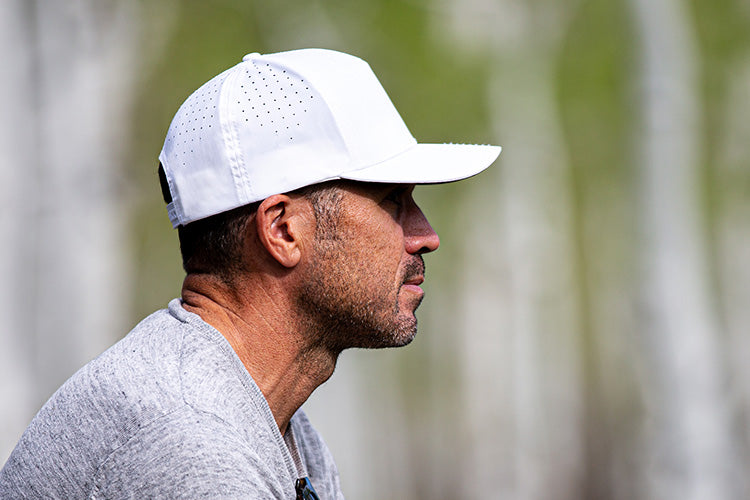 Blvnk Headwear Vanguard tech blank snapback hat on man in Aspen.
