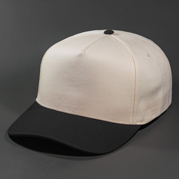 The Blvnk Headwear Origin Vintage Shape Blank Snapback Hat in the Natural & Black color way. 