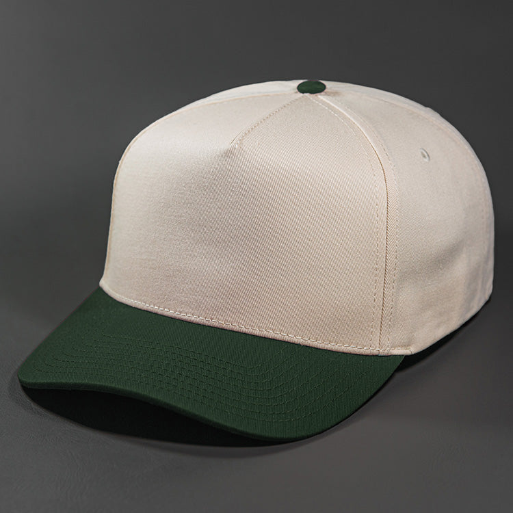 The Blvnk Headwear Origin Vintage Shape Blank Snapback Hat in the Natural and Dark Green color way.