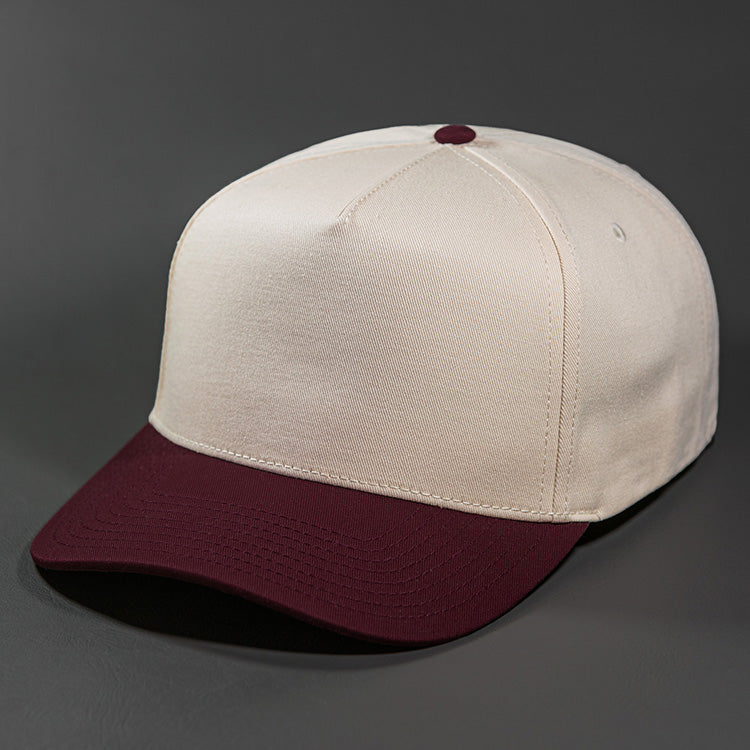 The Blvnk Headwear Origin Vintage Shape Blank Snapback Hat in the Natural and Maroon color way.