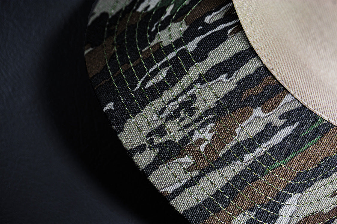 all-groups Blvnk Headwear Origin Vintage Shape blank Snapback in Natural and Realtree Original Camo bill close up.