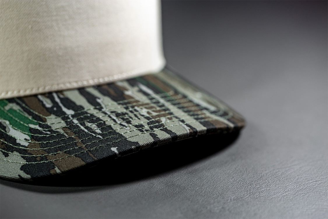all-groups Blvnk Headwear Origin Vintage Shape blank Snapback in Natural and Realtree Original Camo bill close up detail.