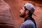 all-groups - A man wearing Blvnk Headwear's Roam Strapback hat in Steel Grey in Secret Canyon, Utah.