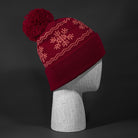 Flakey blank snowflake jacquard pom beanie in Sangria and Carmine by Blvnk Headwear