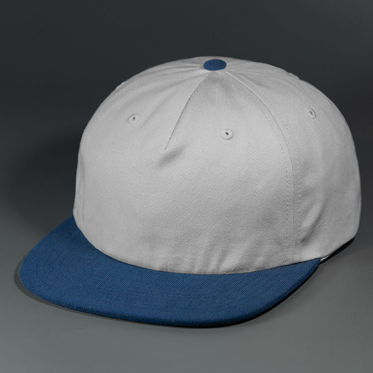 The Rambler blank unstructured corduroy & cotton strap back hat from BLVNK HEADWEAR in Birch and Sea Navy.