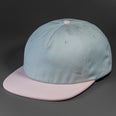 The Rambler blank unstructured corduroy & cotton strap back hat from BLVNK HEADWEAR in Light Pearl and Fun Pink.