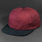 The Rambler blank unstructured corduroy & cotton strap back hat from BLVNK HEADWEAR in Pale Maroon and Black.