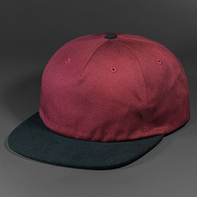 The Rambler blank unstructured corduroy & cotton strap back hat from BLVNK HEADWEAR in Pale Maroon and Black.