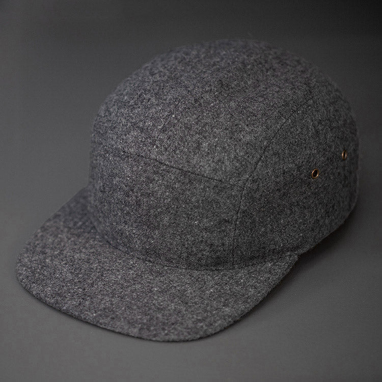 A Warm, Heather Charcoal, Melton Wool, Blank 5 Panel Camp Hat With a Flat Bill, & Leather Strapback. - Designed by Blvnk Headwear.