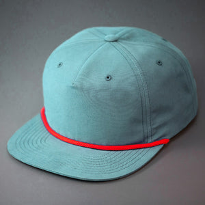 A Seafoam, Grandpa Style Nylon, Pinch Front, Blank Flat Bill with a Red Rope & Classic Snapback. Designed by Blvnk Headwear.