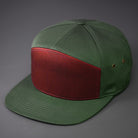 A Dark Cardinal & Military Olive colored, Cotton Twill, Blank 7 Panel Hat with a Flat Bill, Brass Details, & Vegan Leather Strapback. Designed by Blvnk Headwear