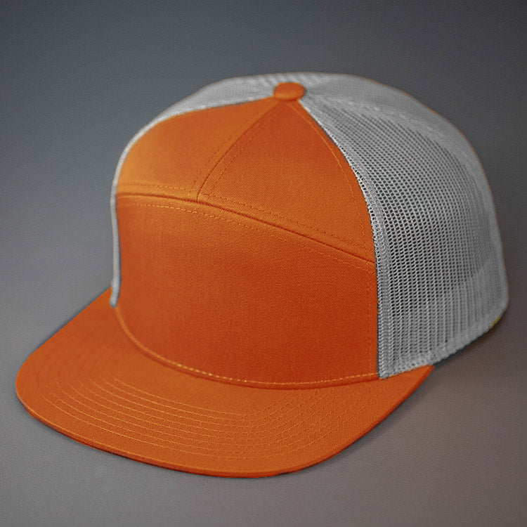 A Dark Orange & Aluminum, Cotton Twill, Mesh Backed Blank 7 Panel Trucker Hat with a Flat Bill, & Classic Snapback. Designed by Blvnk Headwear