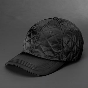 A Black colored Quilted Satin, 6 Panel Crown, Blank Dad Hat with matching fabric Back Strap & Brass Clasp by Blvnk Headwear.