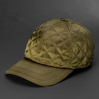 A Loden colored Quilted Satin, 6 Panel Crown, Blank Dad Hat with matching fabric Back Strap & Brass Clasp by Blvnk Headwear.