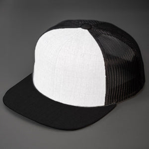 A White Wool Crown, Blank Trucker Hat, With Black Mesh Back Panels, Black Colored Flat Bill & Classic Snapback. Designed by Blvnk Headwear.