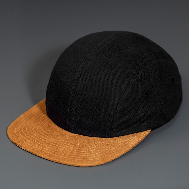 A Black Canvas Crown, Brown Flat Suede Bill, Blank 4 Panel Hat with Matching Canvas Strapback.  Designed by Blvnk Headwear.