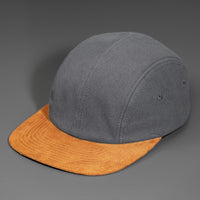 A Steel Canvas Crown, Flat Brown Suede Bill, Blank 4 Panel Hat with Matching Canvas Strapback.  Designed by Blvnk Headwear.