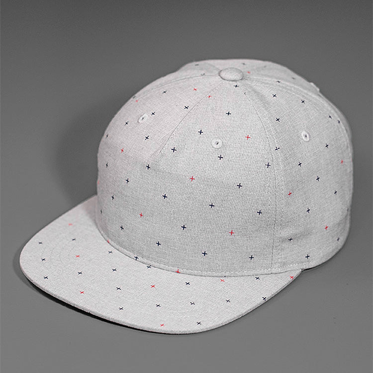 A Light Weight Screen Printed Chambray, Mesh Structured Blank Hat With a Flat Bill, & Strap Back.